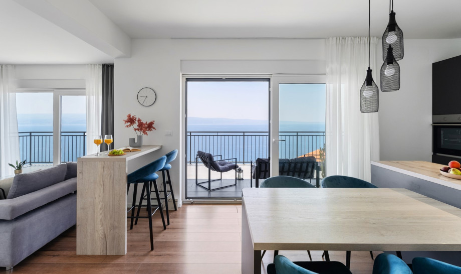 Open plan living area with fully equipped kitchen with a modern kitchen island