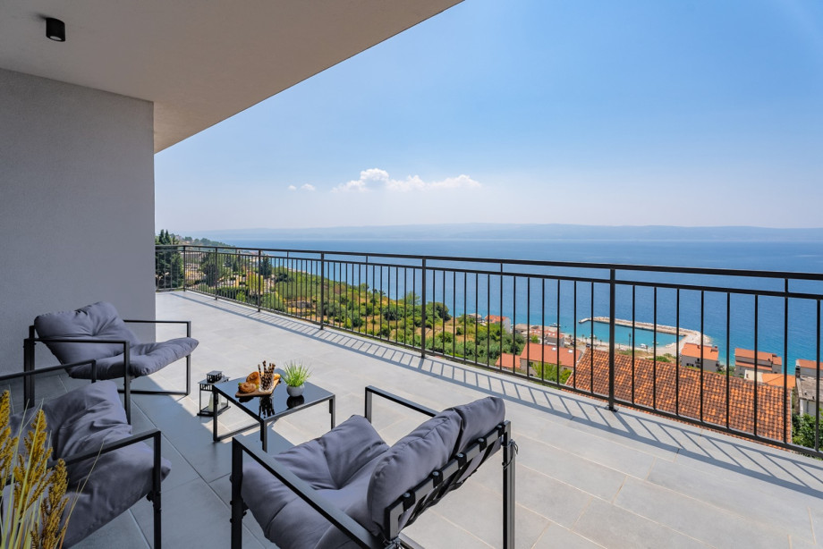Terrace with a sea view that includes chairs and a coffee table can be a perfect space for relaxation