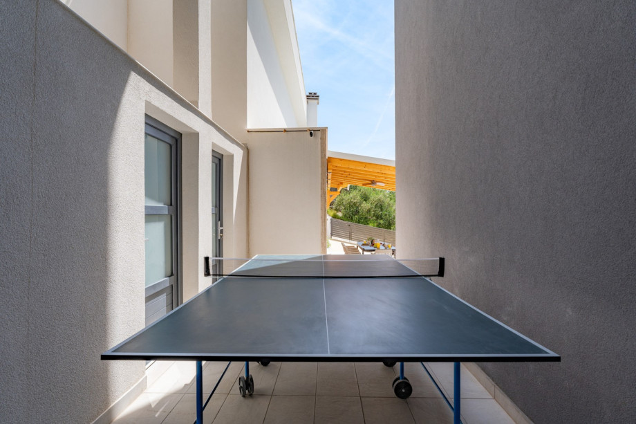Outdoors (pool level) with table tennis