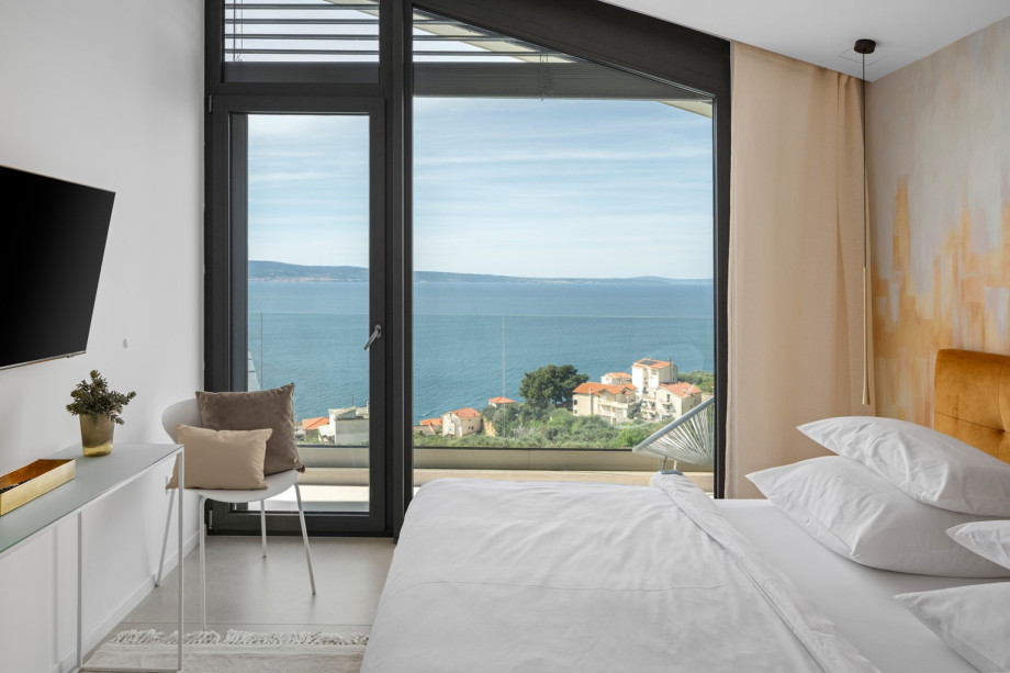Bedroom NO3 with king-size bed, A/C, TV, balcony with views of the pool and sea