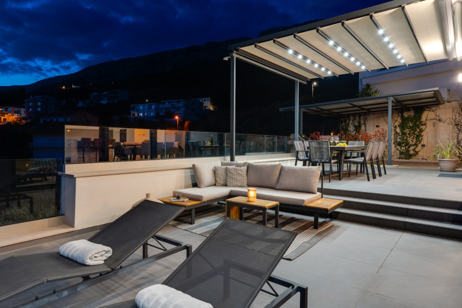 There is a secured parking place on a fenced private plot for 3 cars, also EV charger