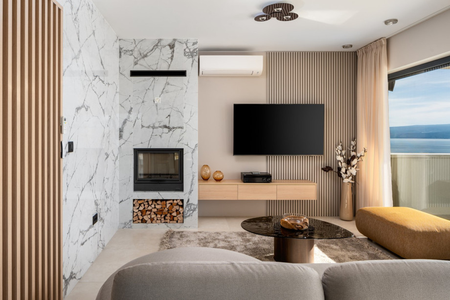 Living area with flat screen TV, A/C, a fireplace