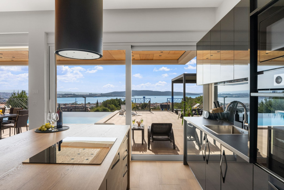 Living room, dining area, and kitchen are all connected by an open-plan layout