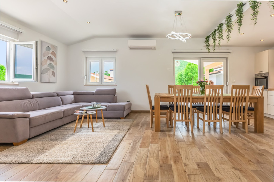 Sliding door toward the covered outdoor dining table and the pool area