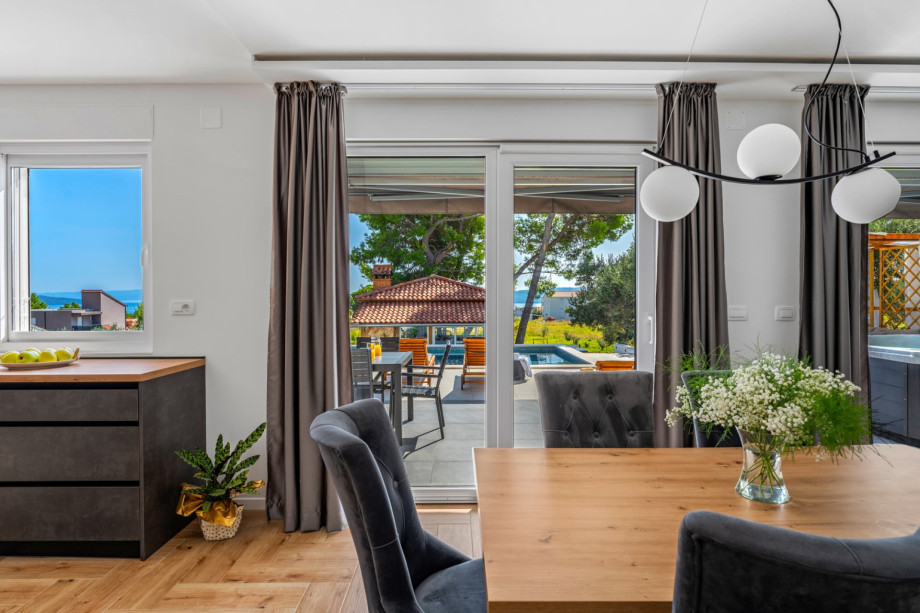 Direct exit to the terrace with pool and sea views