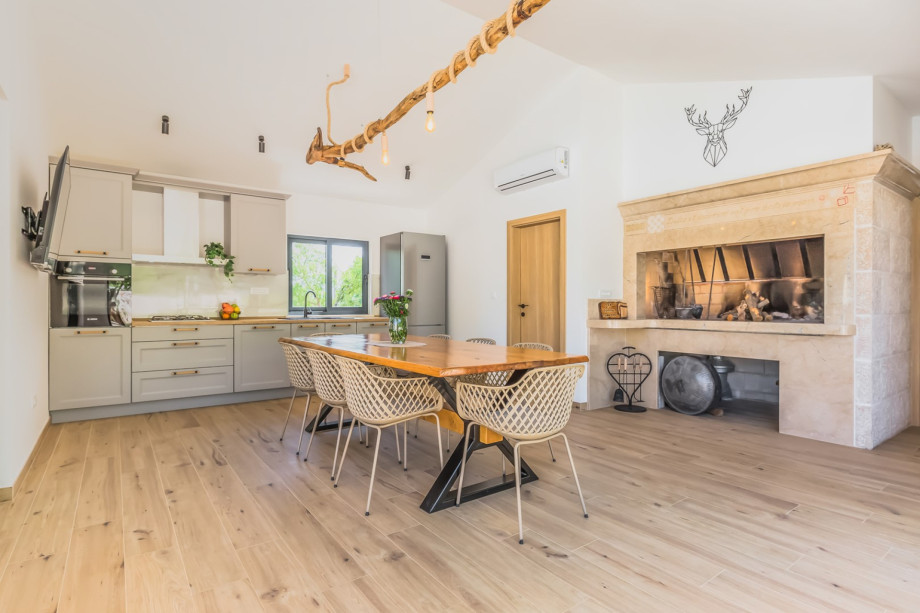 Barbecue area inside of Summer kitchen, wood is provided