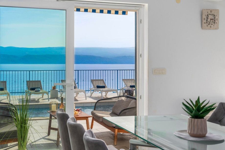 You can directly approach the pool area from the living room and the kitchen