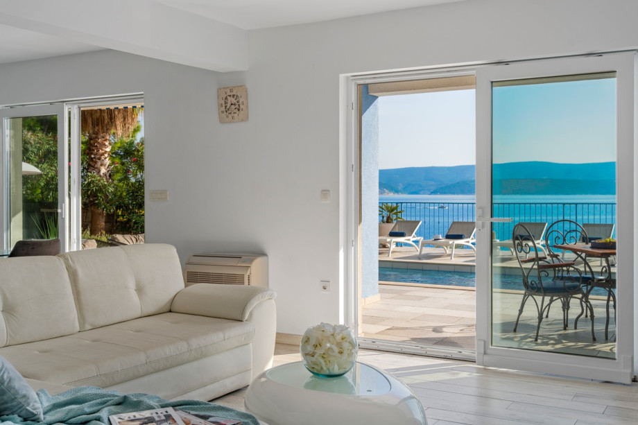 You can directly approach the pool area from the living room and the kitchen