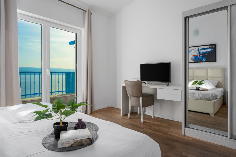 Bedroom NO2 en-suite bathroom with a shower and exit to a seaview balcony