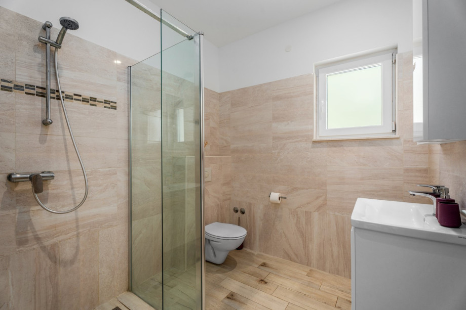 En-suite bathroom with a shower, towels are provided