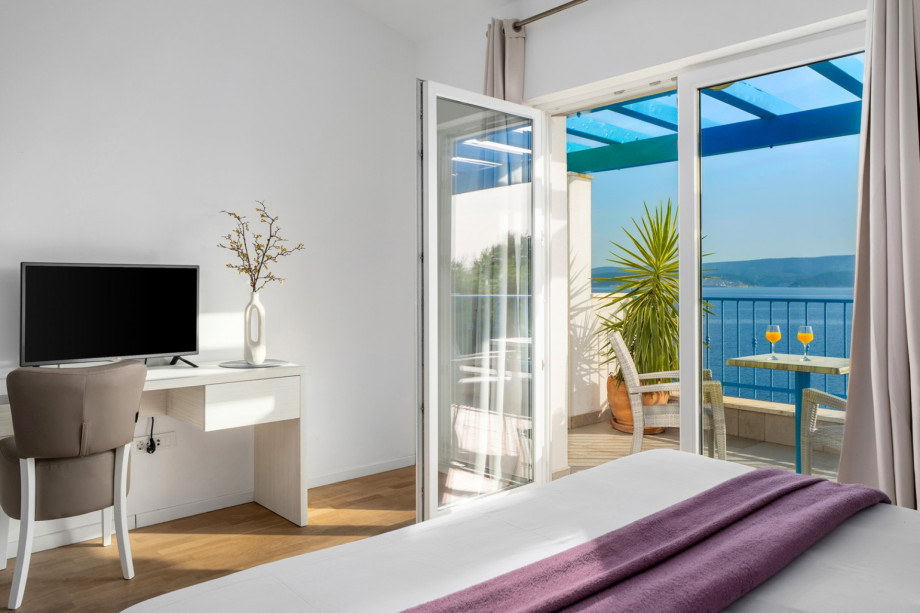Bedroom NO3 with en-suite bathroom with a shower and exit to a seaview balcony