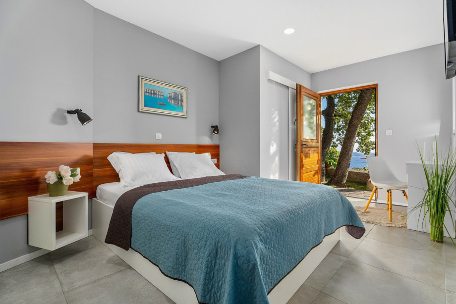 A Bedroom NO1 with a queen-size bed 160cm x 200cm, TV, a smaller en-suite bathroom with a shower