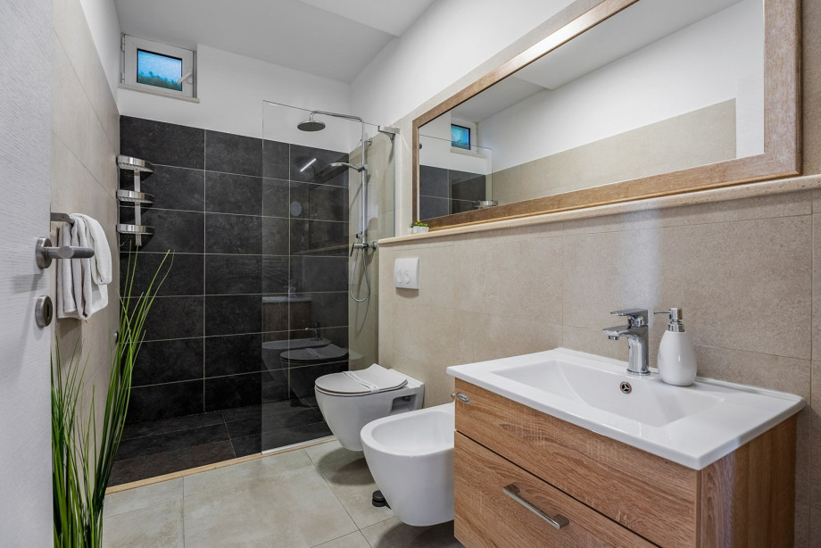 Family bathroom with a shower, toilet and a bidet
