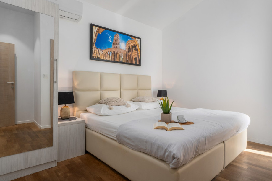 Bedroom NO5 with a king size bed 180cm x 200cm, A/C, TV, en-suite bathroom with a shower and a smaller balcony