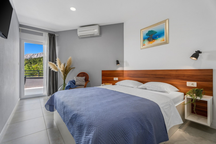 Bedroom NO4 with a queen size bed 160cm x 200cm, A/C, TV, with a direct approach to the terrace shared with Bedroom NO3