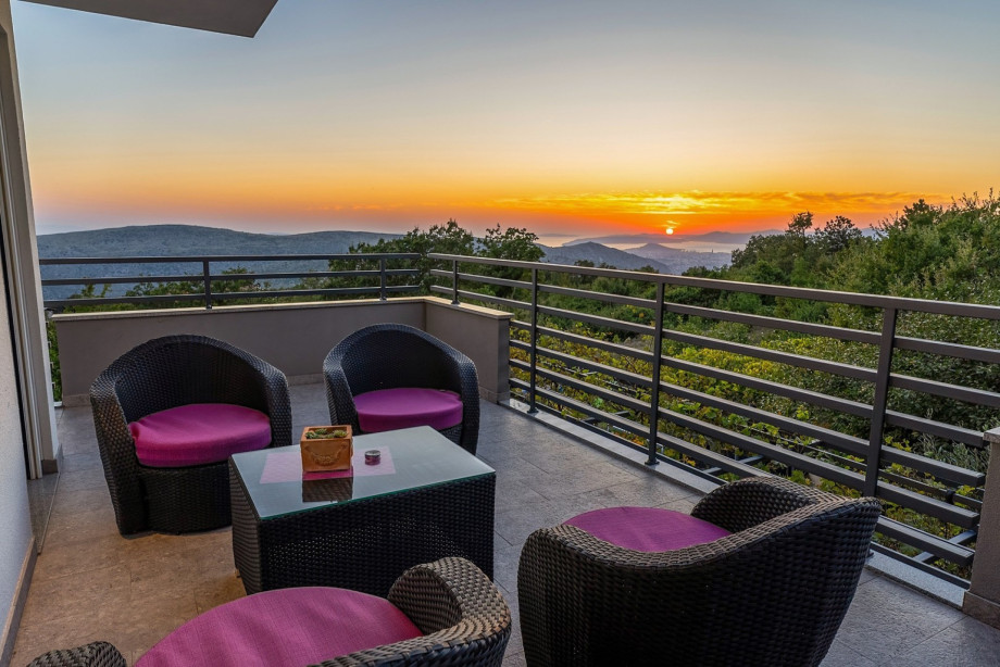 Lounge furniture on the first floor terrace which is shared between Bedroom NO3 and NO4