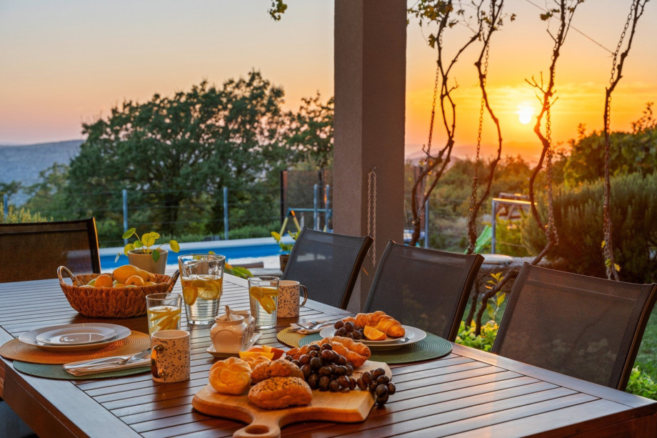 Covered outdoor dining area with amazing view