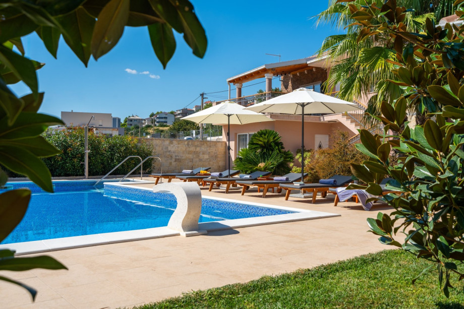 a private, heated 10m x 5m pool with massage system, 6 deck chairs and 2 parasols