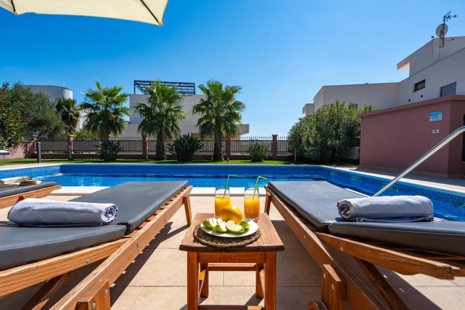 a private, heated 10m x 5m pool with massage system, 6 deck chairs and 2 parasols