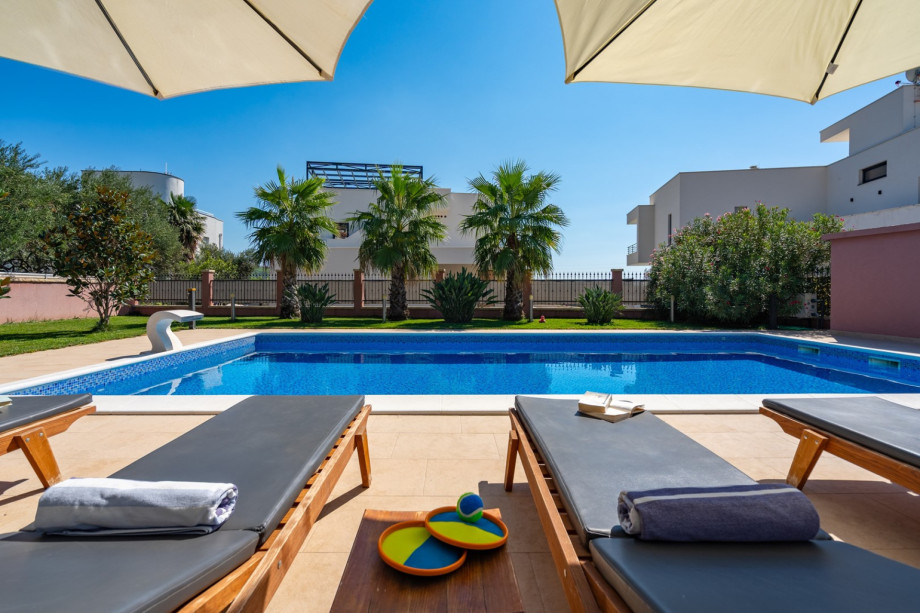 a private, heated 10m x 5m pool with massage system, 6 deck chairs and 2 parasols