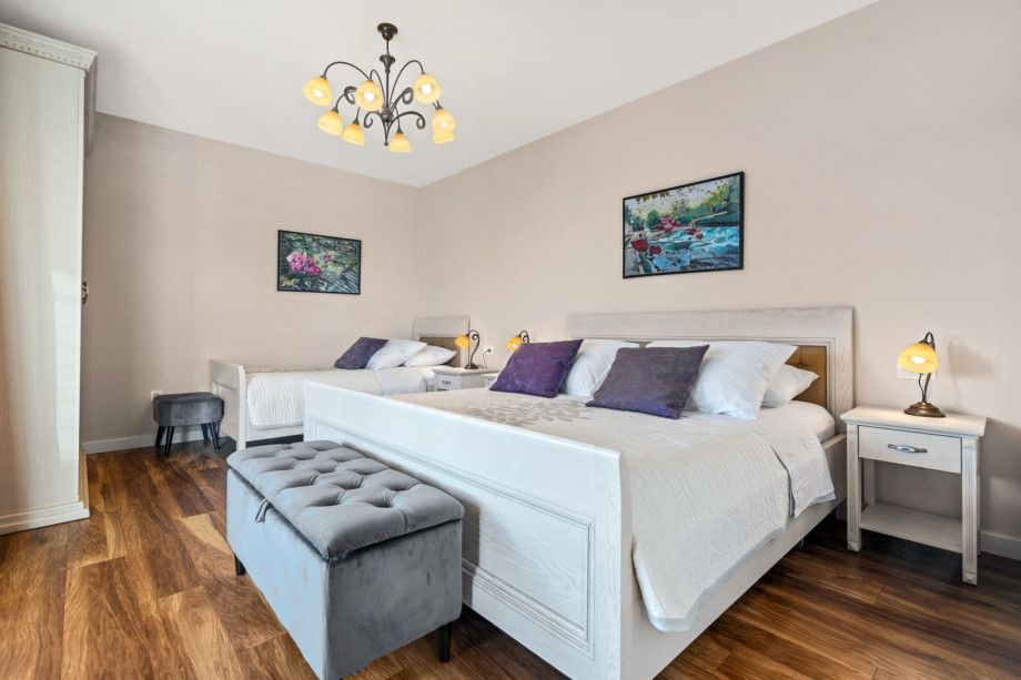 Bedroom No2 with king size bed 180cm x 200cm and a single bed 90cm x 200cm, A/C and exit to the terrace with lounge furniture