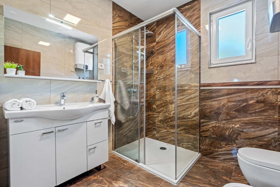 A Family Bathroom No3 with a shower.