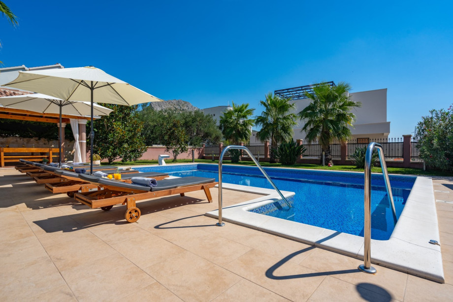 a private, heated 10m x 5m pool with massage system, 6 deck chairs and 2 parasols