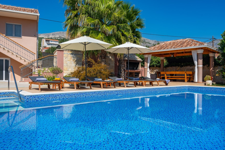 a private, heated 10m x 5m pool with massage system, 6 deck chairs and 2 parasols