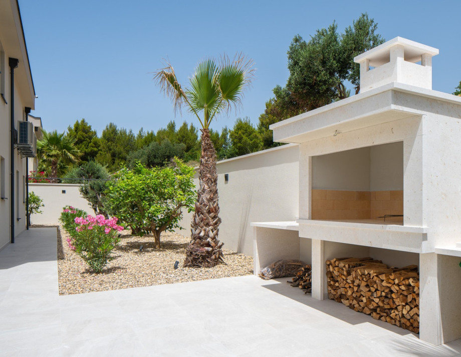 Traditional barbecue corner for your grilling prowess behind the lounge corner