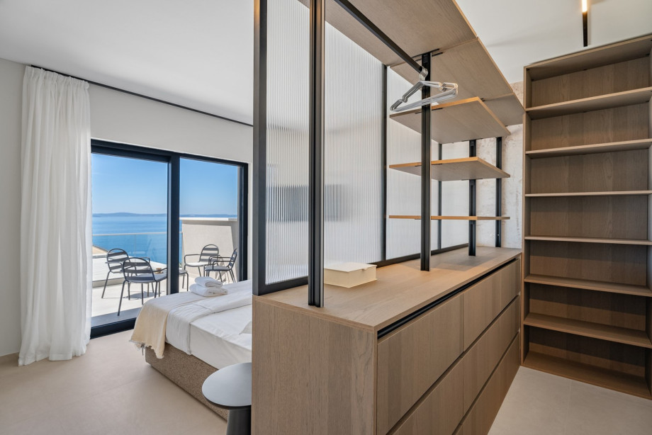 Bedroom No. 2 features a 200cm x 200cm super king-size bed, TV, A/C