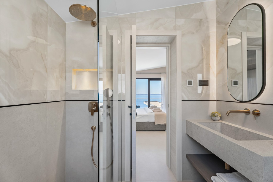 Private bathroom with a shower, towels are provided