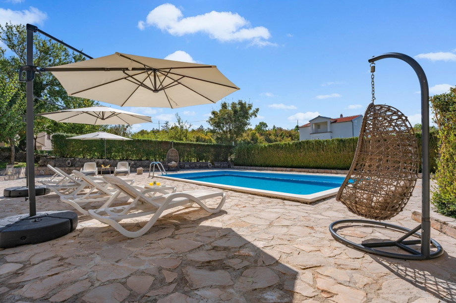 Large umbrellas provide shade on the large sunbathing area