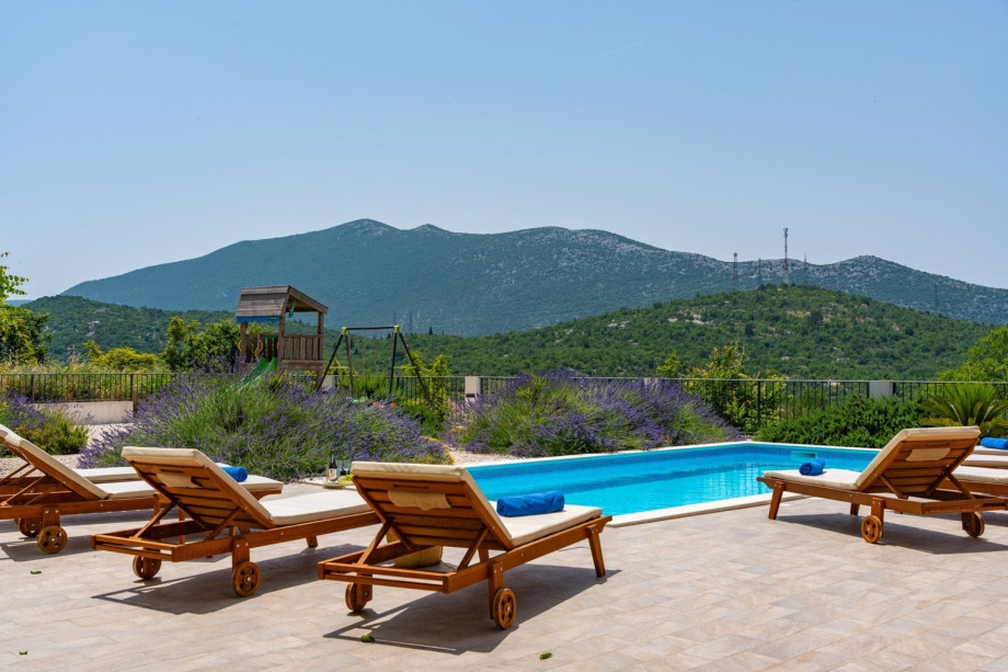 Heated 32 sqm pool with massage, sun deck area with 8 deck chairs