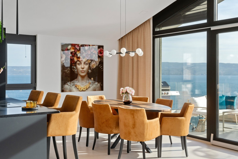 Living room, dining area, and kitchen are all connected by an open-plan layout