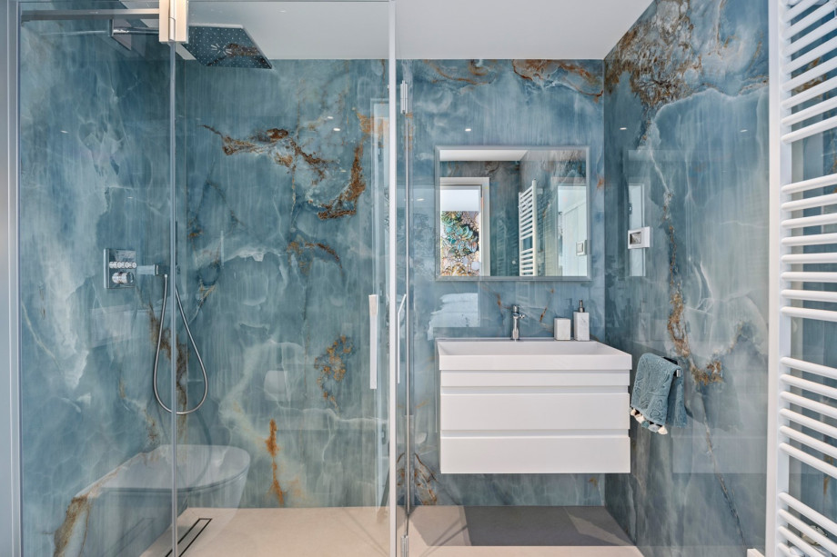 En-suite bathroom with a shower, towels are provided