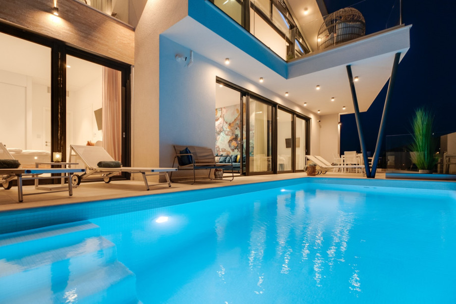 Private heated swimming pool, with sunbathing area