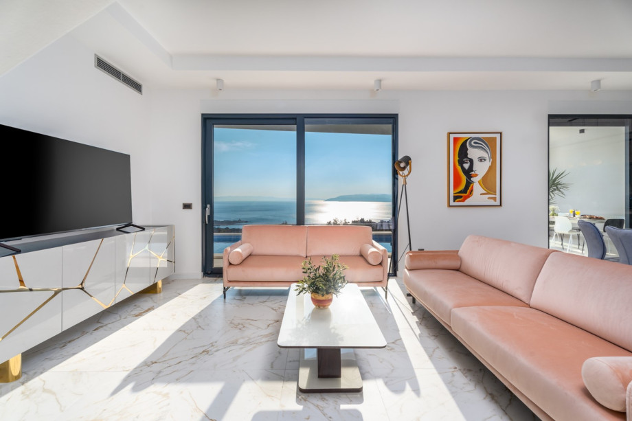 A spacious and stylish living room with comfortable sofas.