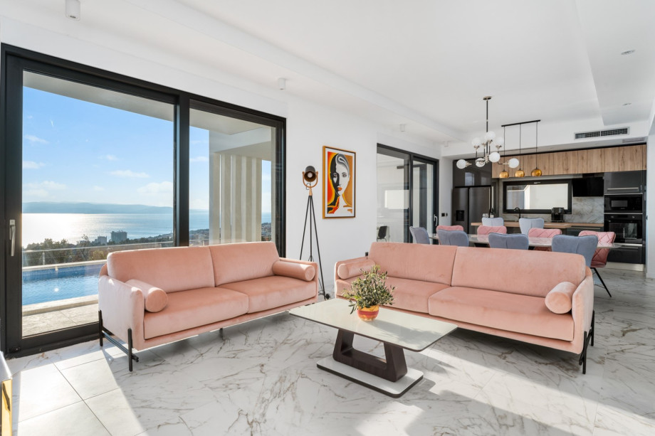 The Ground floor offers an open-plan living area with a flat-screen TV, a Party box speaker, and free WiFi.