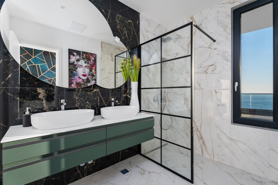 En-suite bathroom with a shower, and amazing sea views.