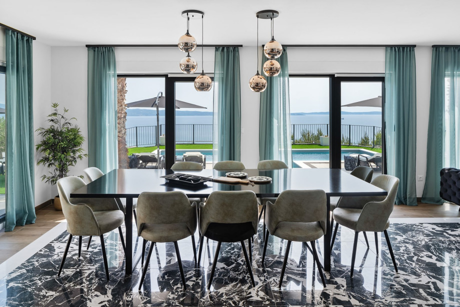 Spacious dining room with a large table and chairs for 10 people