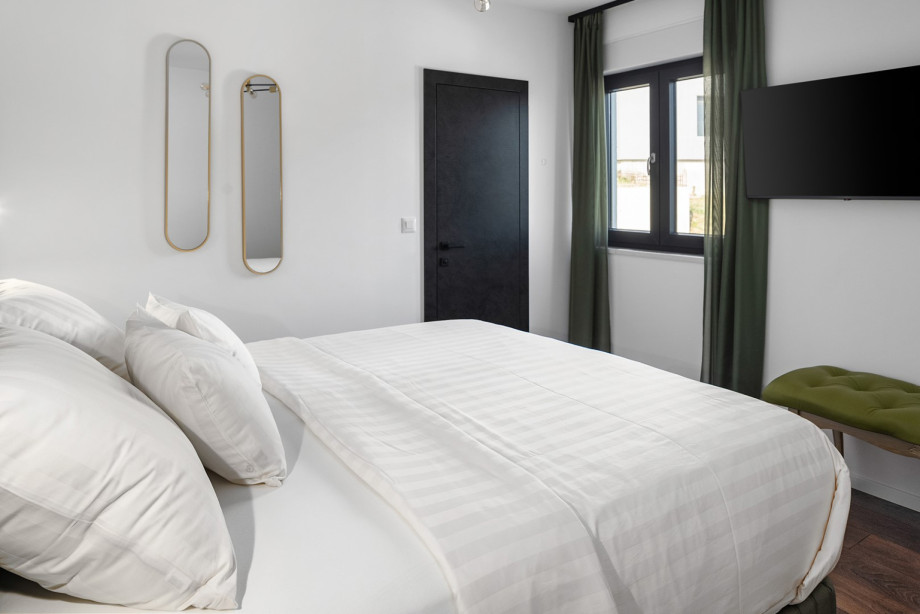 En-suite with shower, a TV, views of the natural surroundings