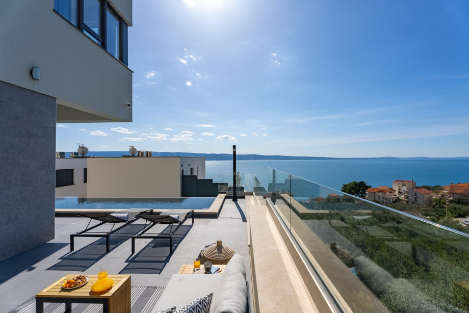 Sun-deck area with 5 deck chairs and sea views