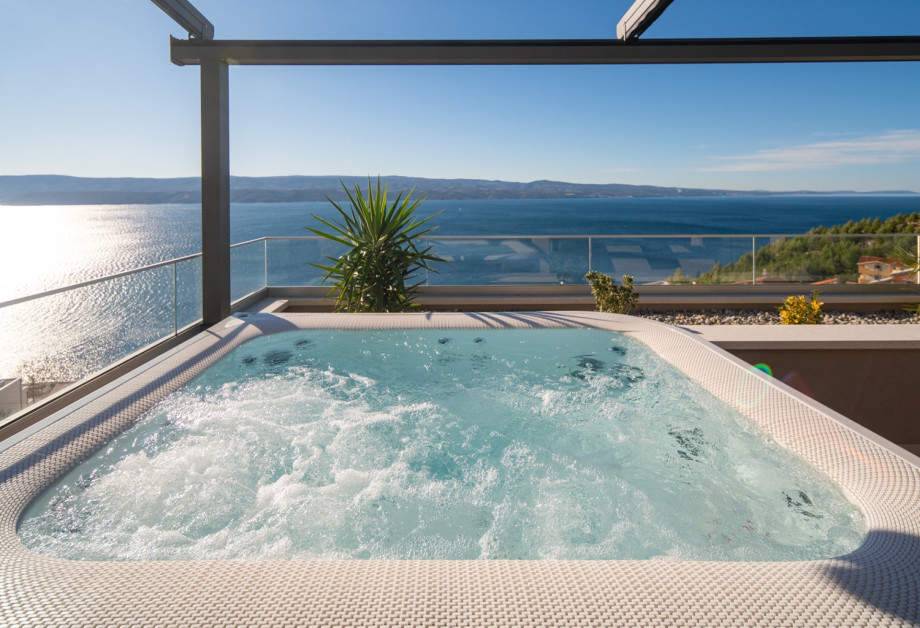 The master bedroom's terrace features a private, bubbling Jacuzzi (Whirlpool) where you can soak up the sun and the magnificent sea views.