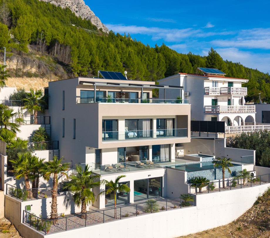 The villa is organised over four levels, with 500 sqm of interior space perched on a slope, providing breathtaking sea views from every room.