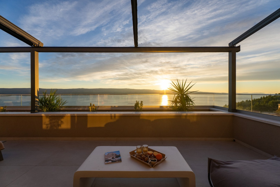 The upper terrace features a lounge corner for comfort and breathtaking views at sunrise or sunset.