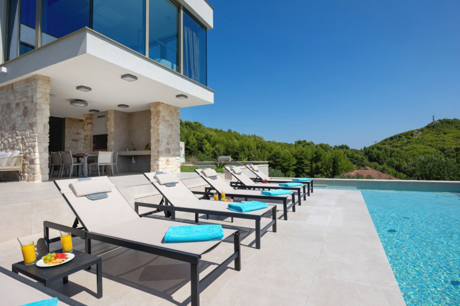 Relax on the sun deck with 6 deck chairs next to the private heated swimming pool and covered barbecue area.