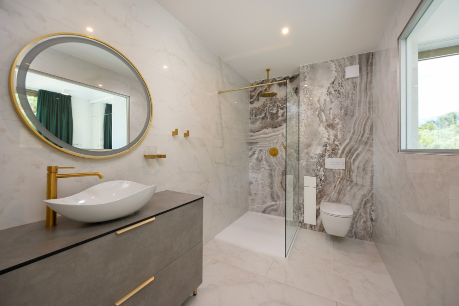 En-suite bathroom with a shower in Bedroom 4, offering views of olive groves and mountains outside.
