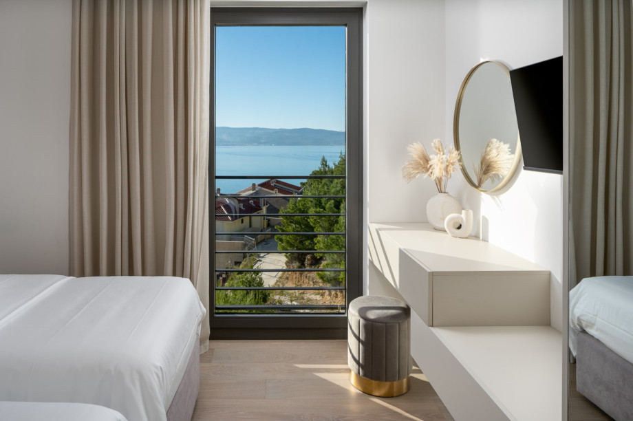 Bedroom No2 (12sqm) with two single beds  (can convert into a king-size bed), TV, A/C, sea view.