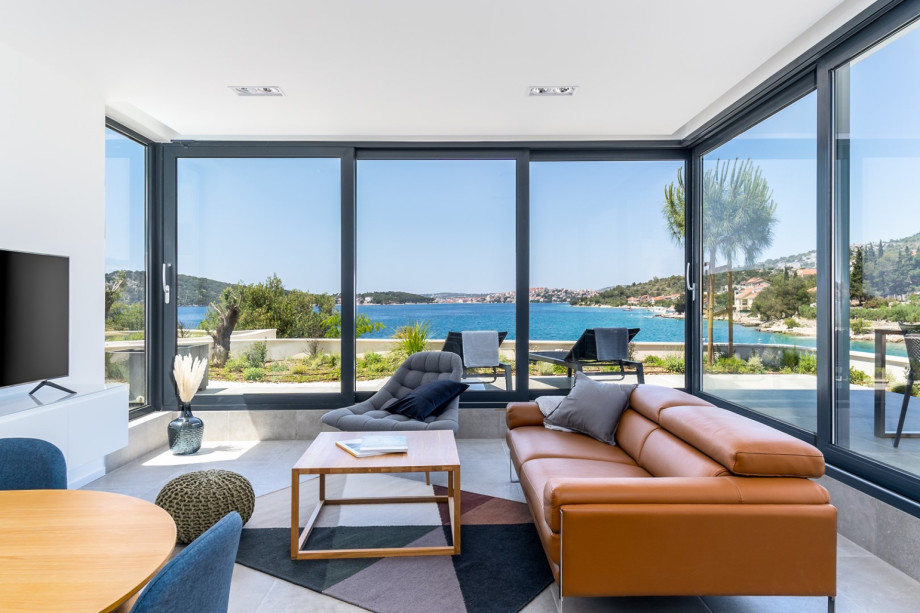 a direct approach to a terrace with dining table and amazing sew views