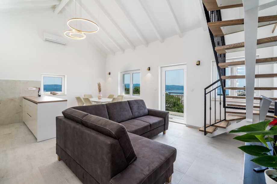 The GROUND floor includes a very light and pleasant living area with a comfortably furnished and fully equipped kitchen